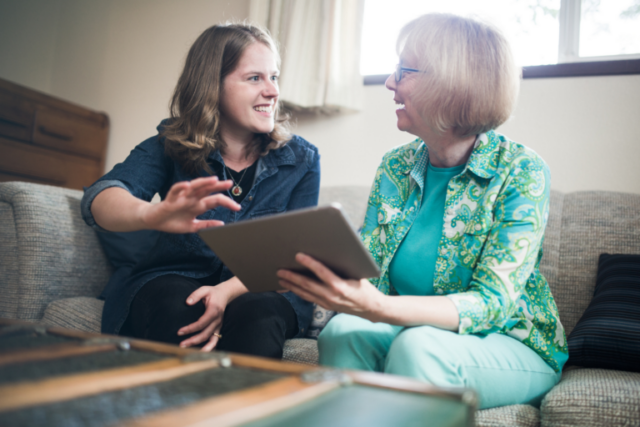 Young woman and old woman talking